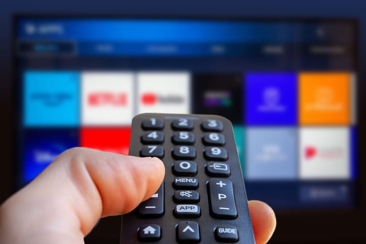 FAST TV Streaming Services, a remote pointing at a streaming TV