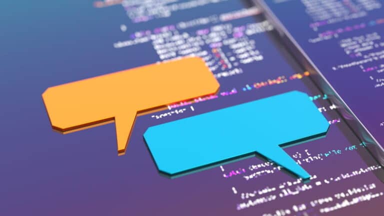 Website coding with speech bubbles over it.